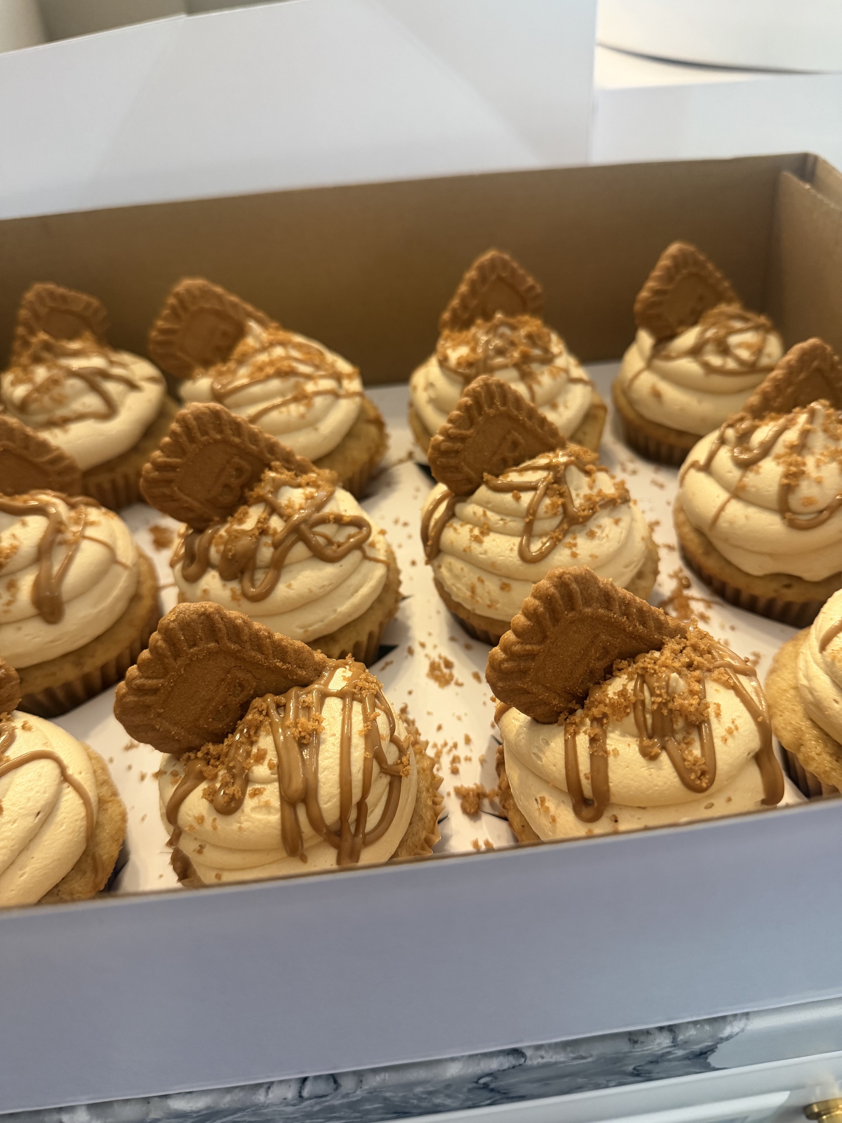 Cookie butter cupcakes in a bakery box