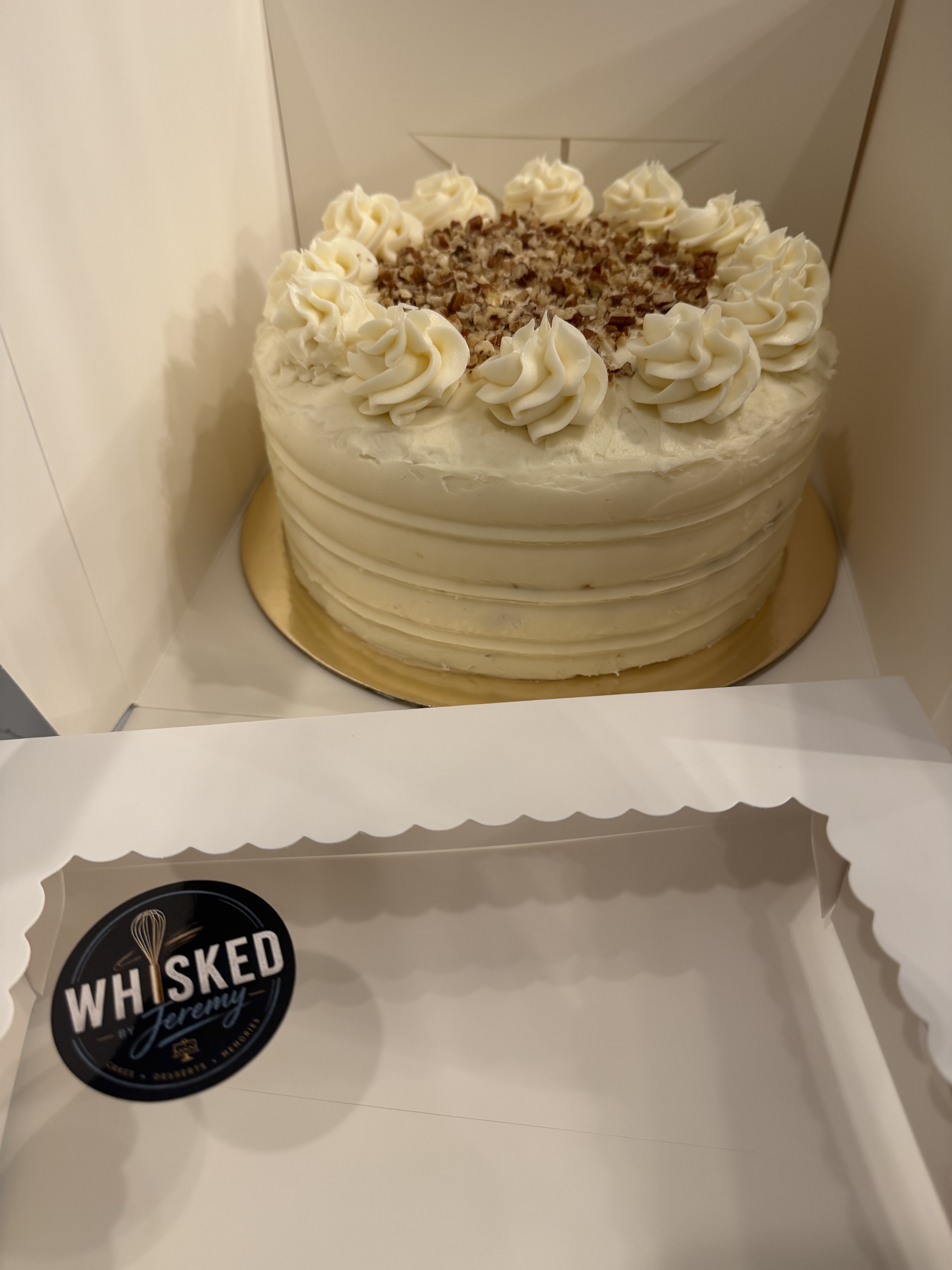 Carrot cake packaged with Whisked By Jeremy branding
